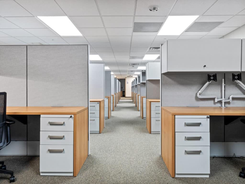 Furnished open-plan workstations inside the two-story modular military office building