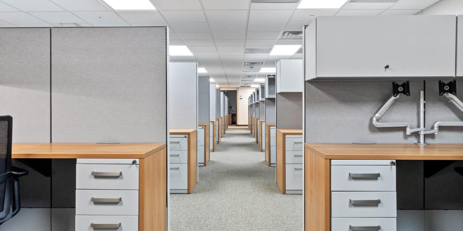 Furnished open-plan workstations inside the two-story modular military office building