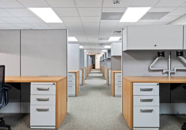 Furnished open-plan workstations inside the two-story modular military office building