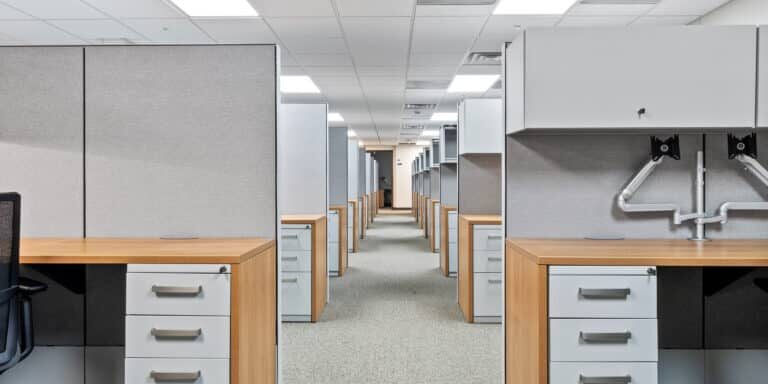 Furnished open-plan workstations inside the two-story modular military office building